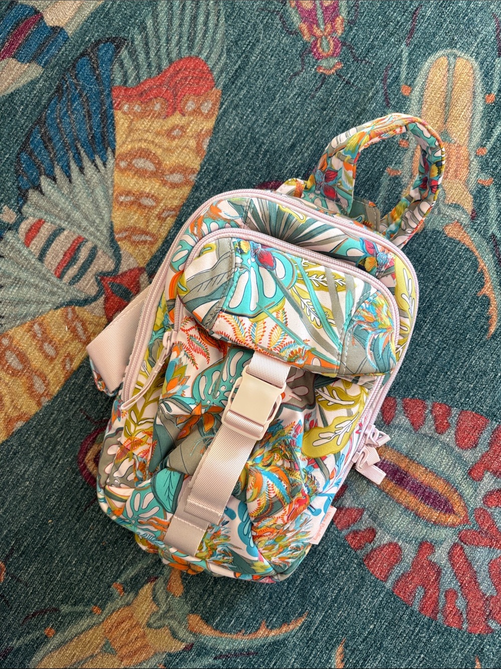 Adorable like new Vera Bradley utility sling backpack in rainforest canopy